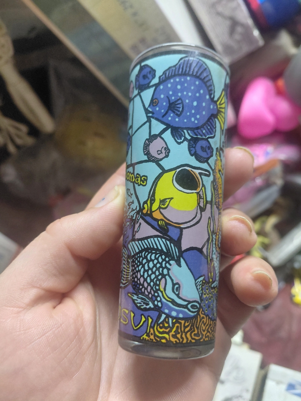tall souvenir shot glass featuring a colorful painted tropical fish 4"x1.5"